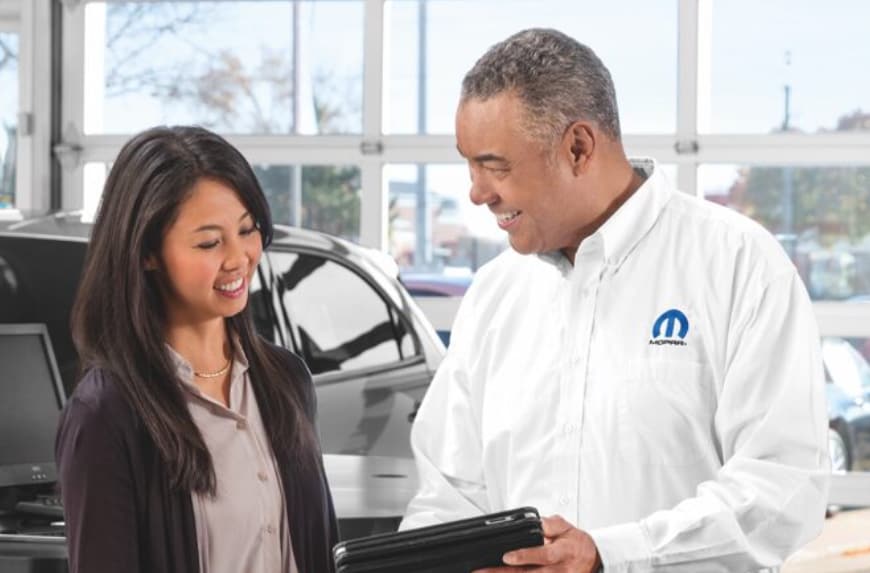 Service manager speaking to a customer.