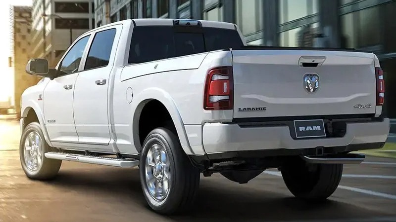 Back of a White Ram Truck in a city.