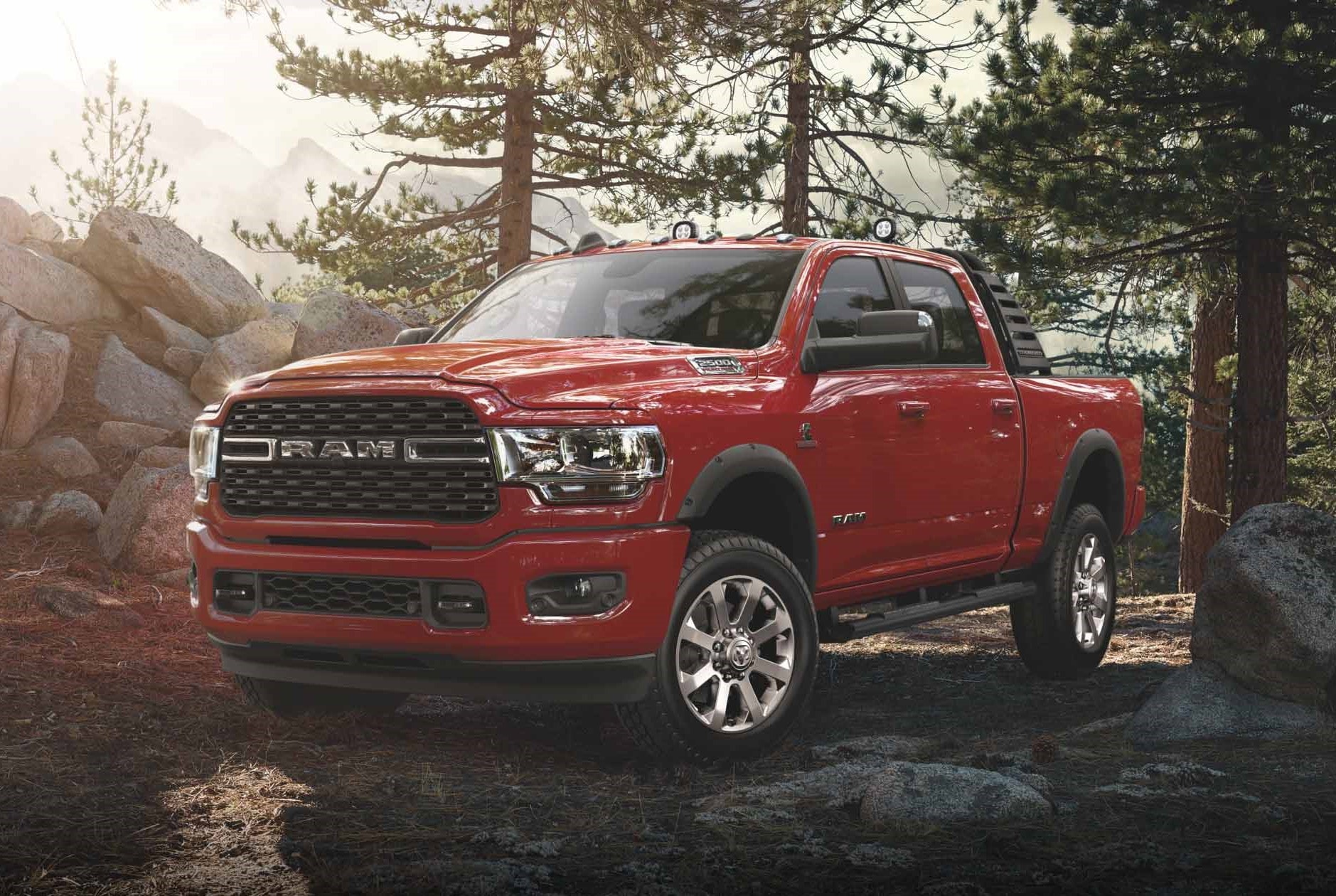 red Ram 2500 truck parked in a forest area