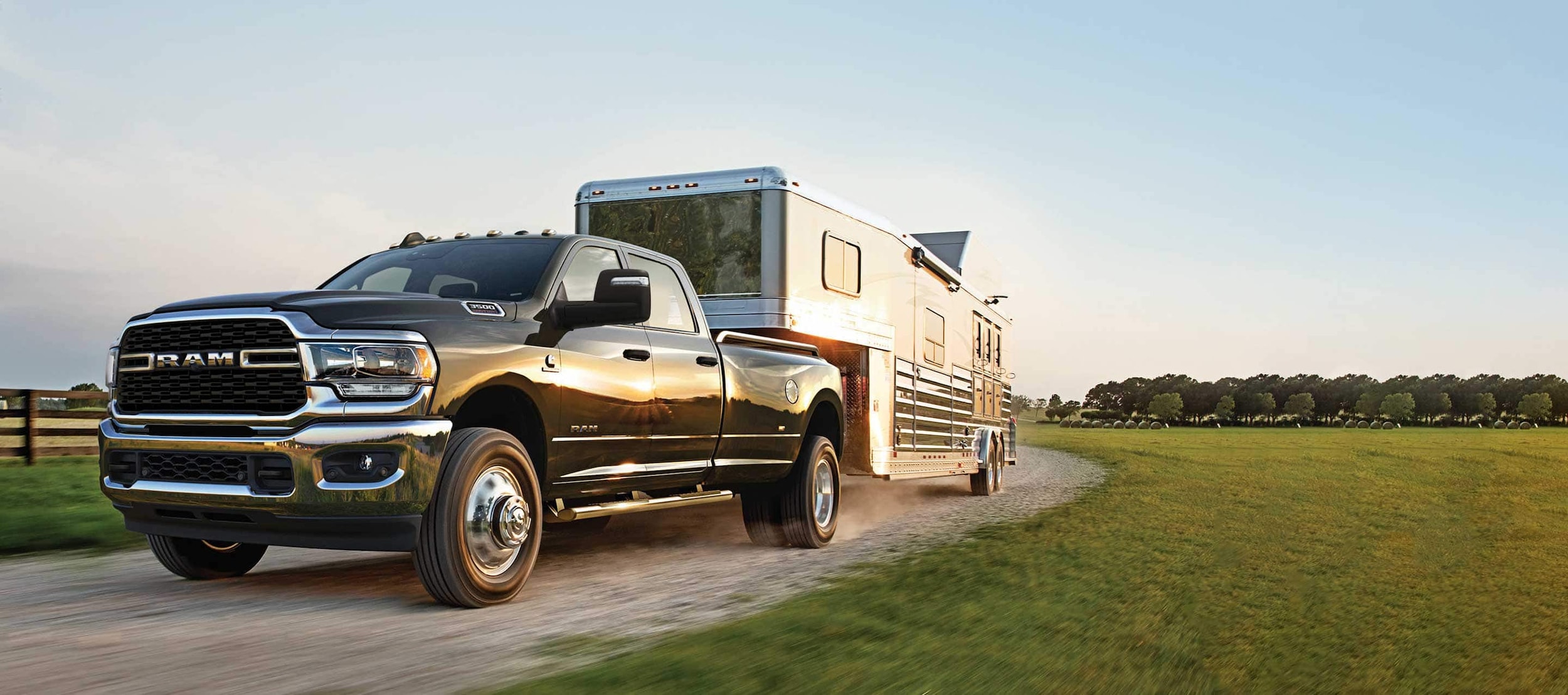 black Ram 3500 truck towing a trailer