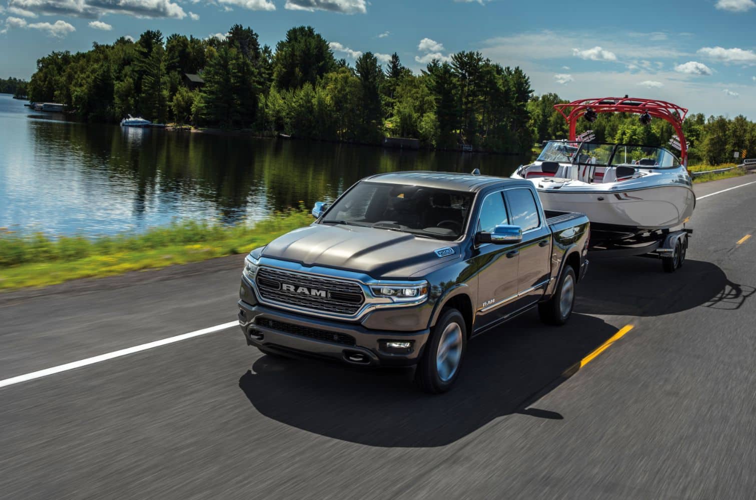 dark grey Ram 1500 truck towing a boat