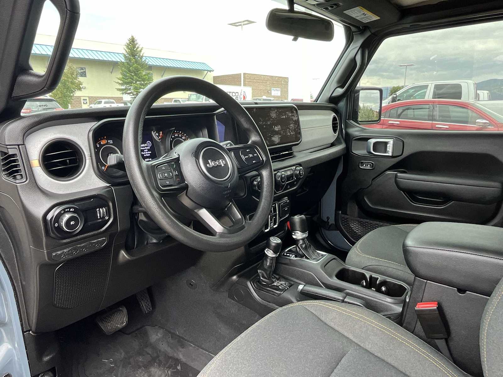 Used 2025 Jeep Wrangler 4-Door Sport with VIN 1C4PJXDN4SW503427 for sale in Missoula, MT