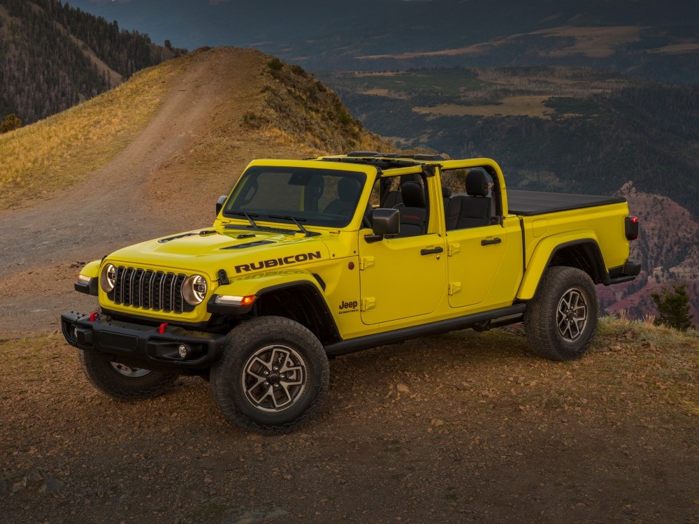 red Jeep Gladiator parked in a desert