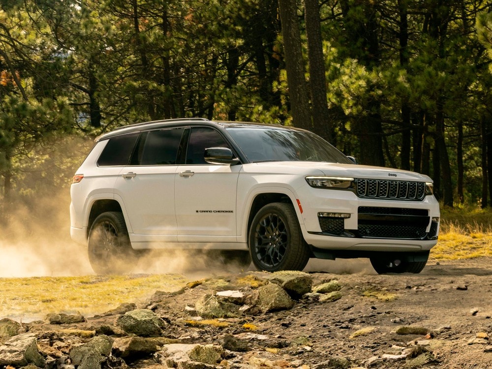 red Jeep Gladiator parked in a desert