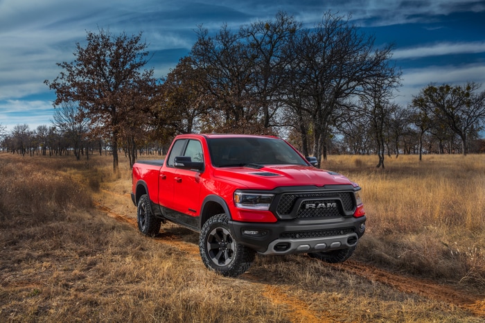 red Ram 1500 truck driving on a dusty, dry field