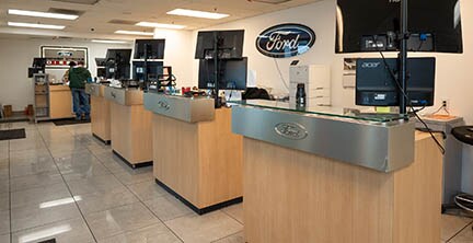 Row of service advisor desks at Lithia Ford of Fresno Service Center