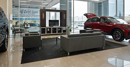 Lithia Ford of Fresno customer lounge couches and television