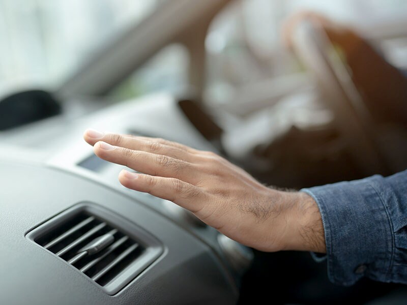 Hand over car air vent