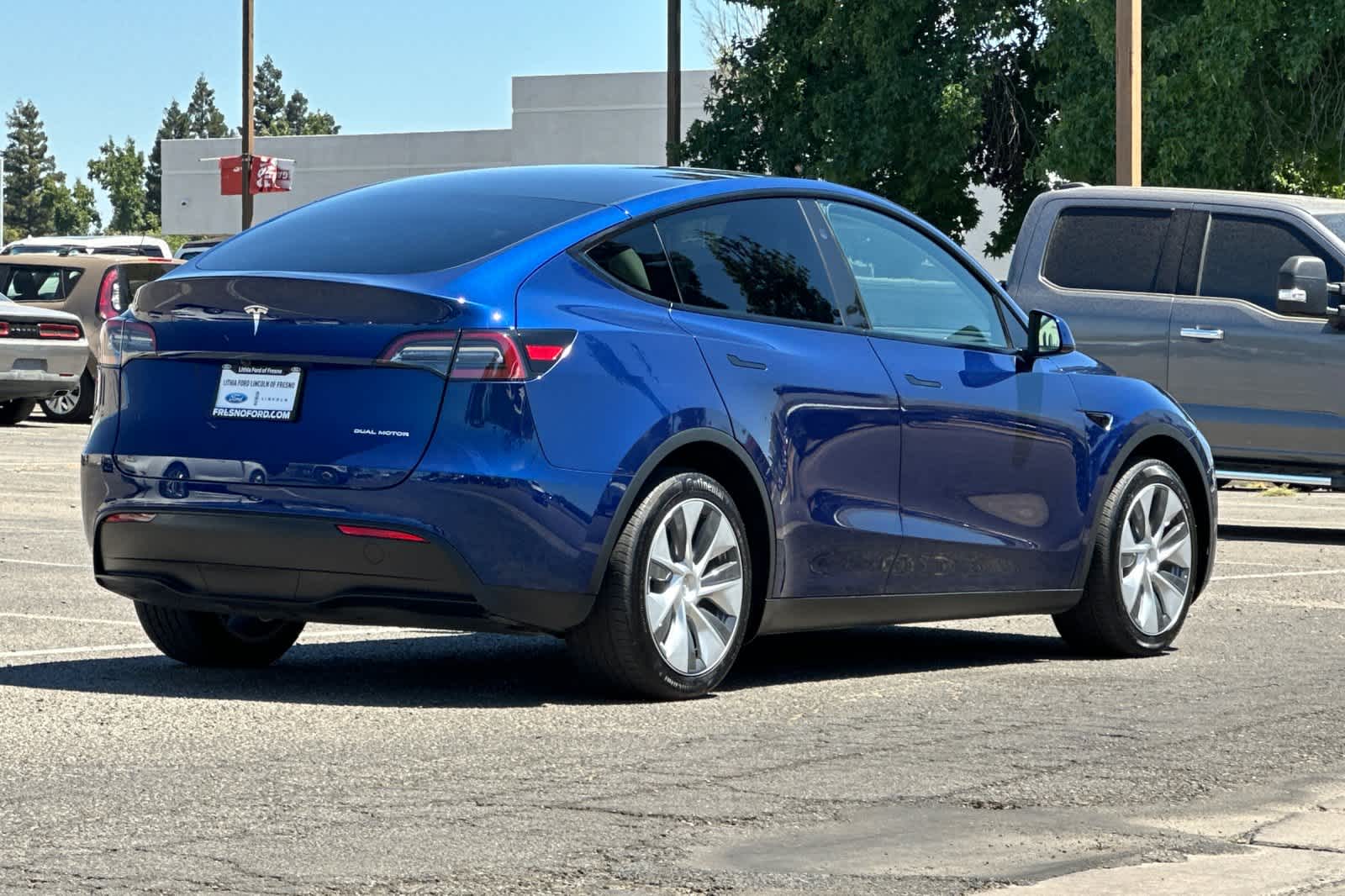 Used 2024 Tesla Model Y Long Range with VIN 7SAYGAEE5RF987477 for sale in Fresno, CA
