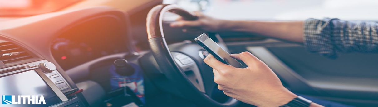 Man texting while driving
