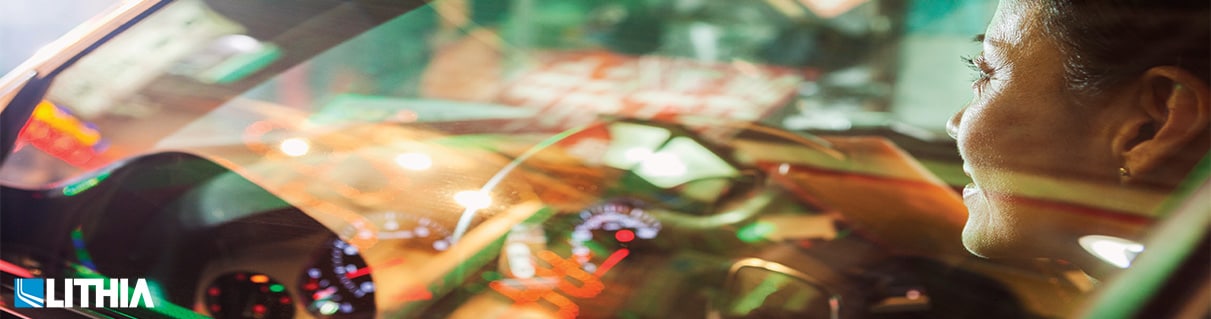 Lady driving a car in the city