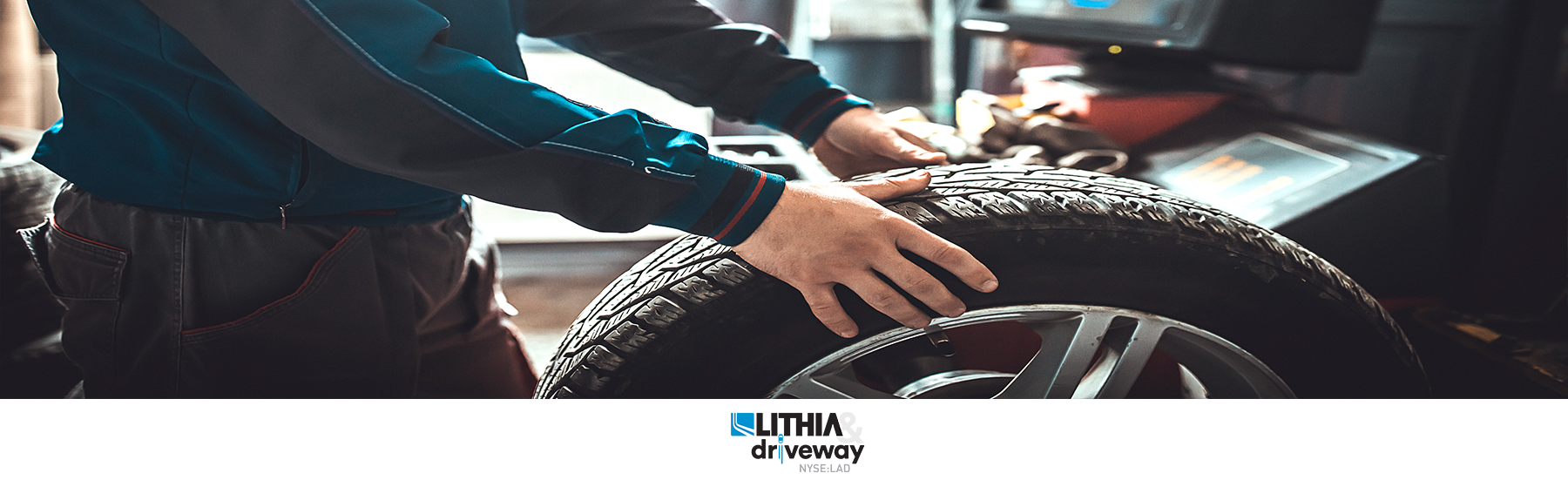 Mechanic balancing a tire in auto repair shop