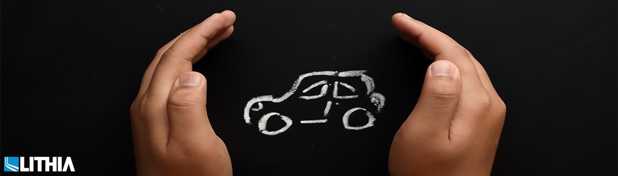 Hand holding drawn car