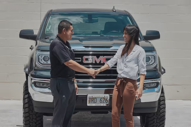 Customer trading in a vehicle at a GMC dealership