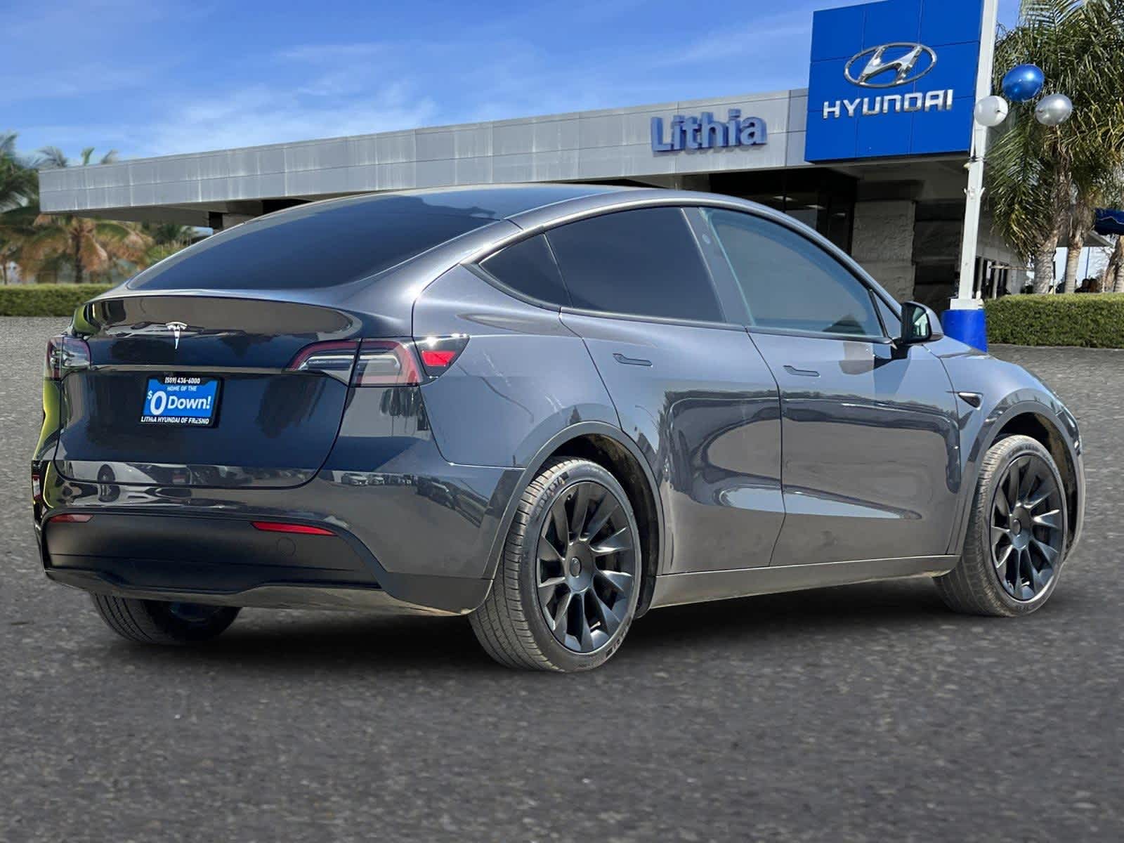Used 2024 Tesla Model Y Long Range with VIN 7SAYGDED2RF056301 for sale in Fresno, CA