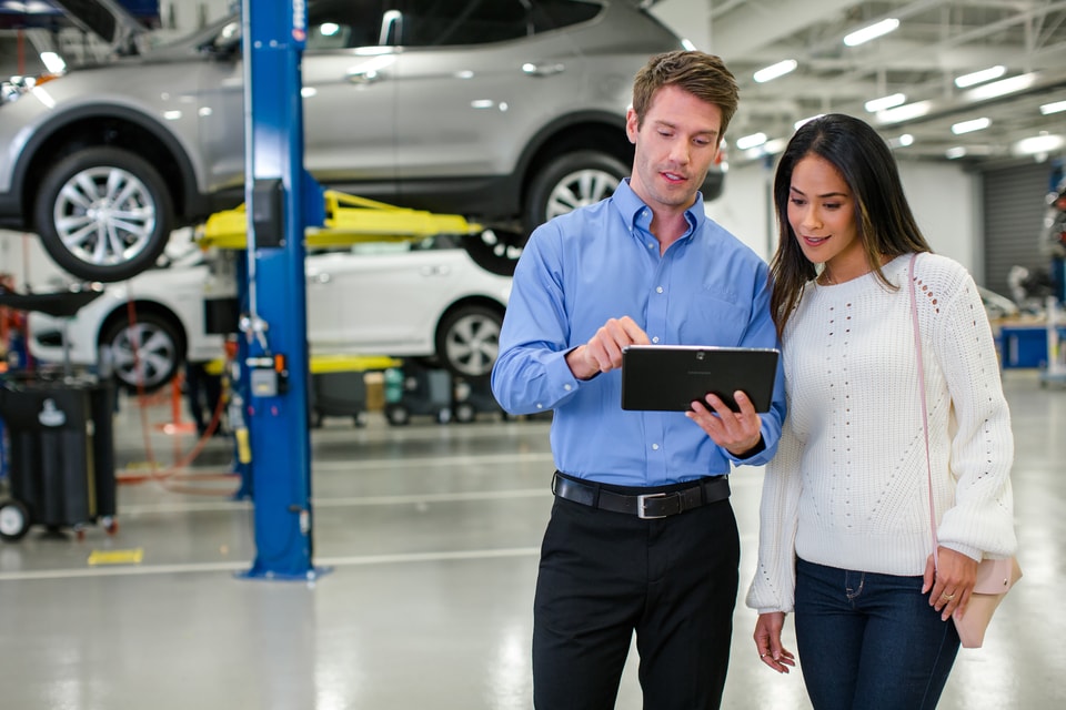 Hyundai service advisor working with a customer