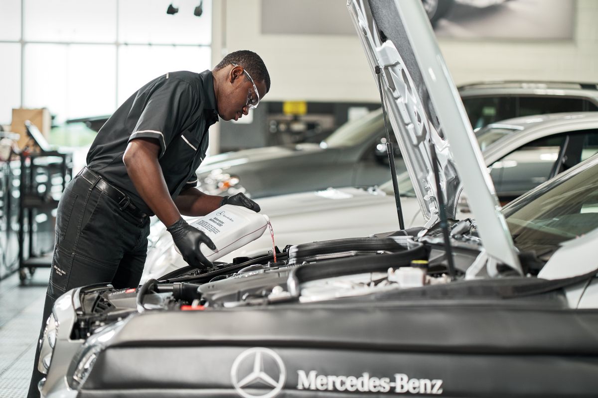 Mercedes-Benz technician performing scheduled maintenance