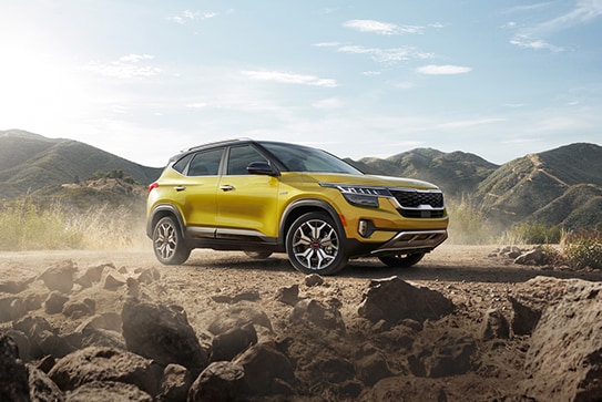 yellow Kia Seltos parked near Vasquez