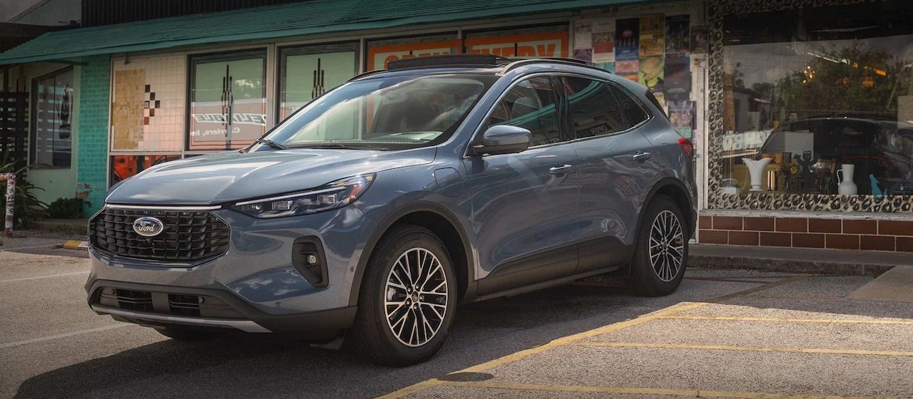 powder blue Ford SUV parked at a thrift shop