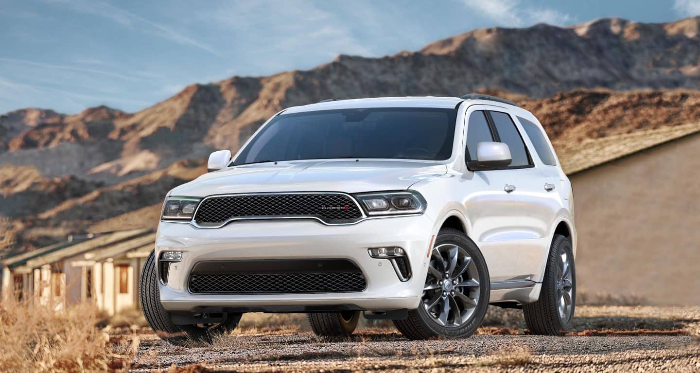 white Dodge Durango SUV parked on a dirt lot