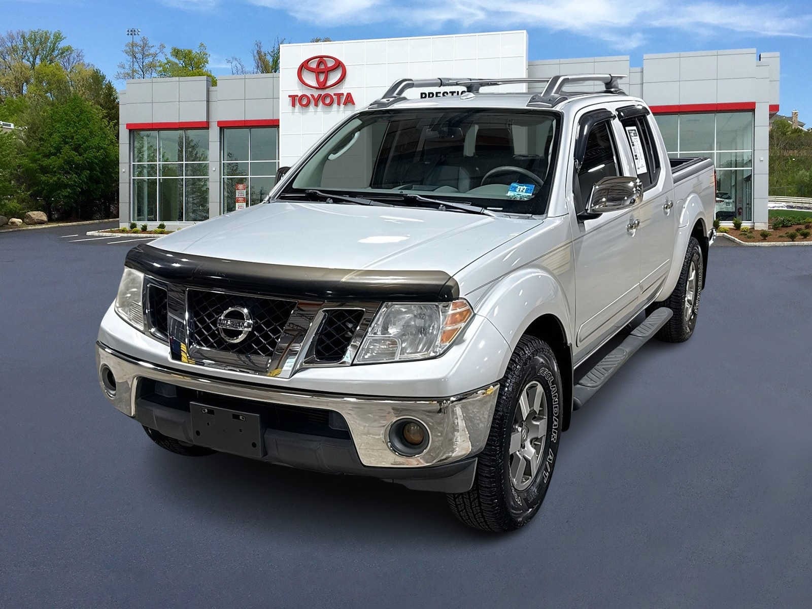 Radiant Silver 2010 Nissan Frontier Pickup Truck Four-Wheel Drive Automatic