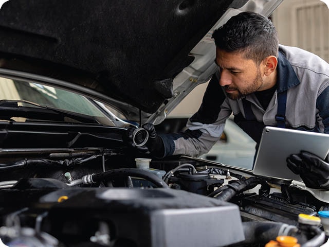 Mobile automotive repair services available in Roseburg, OR. Mobile mechanic working on a vehicle.