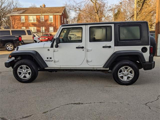 Used 2009 Jeep Wrangler Unlimited For Sale at The Suburban Collection | VIN:  1J4GA39159L775036