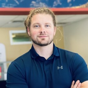 Staff member Aaron Rachie from ID_672337