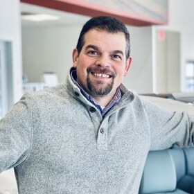 Staff member Andrew Kaminski from ID_672337