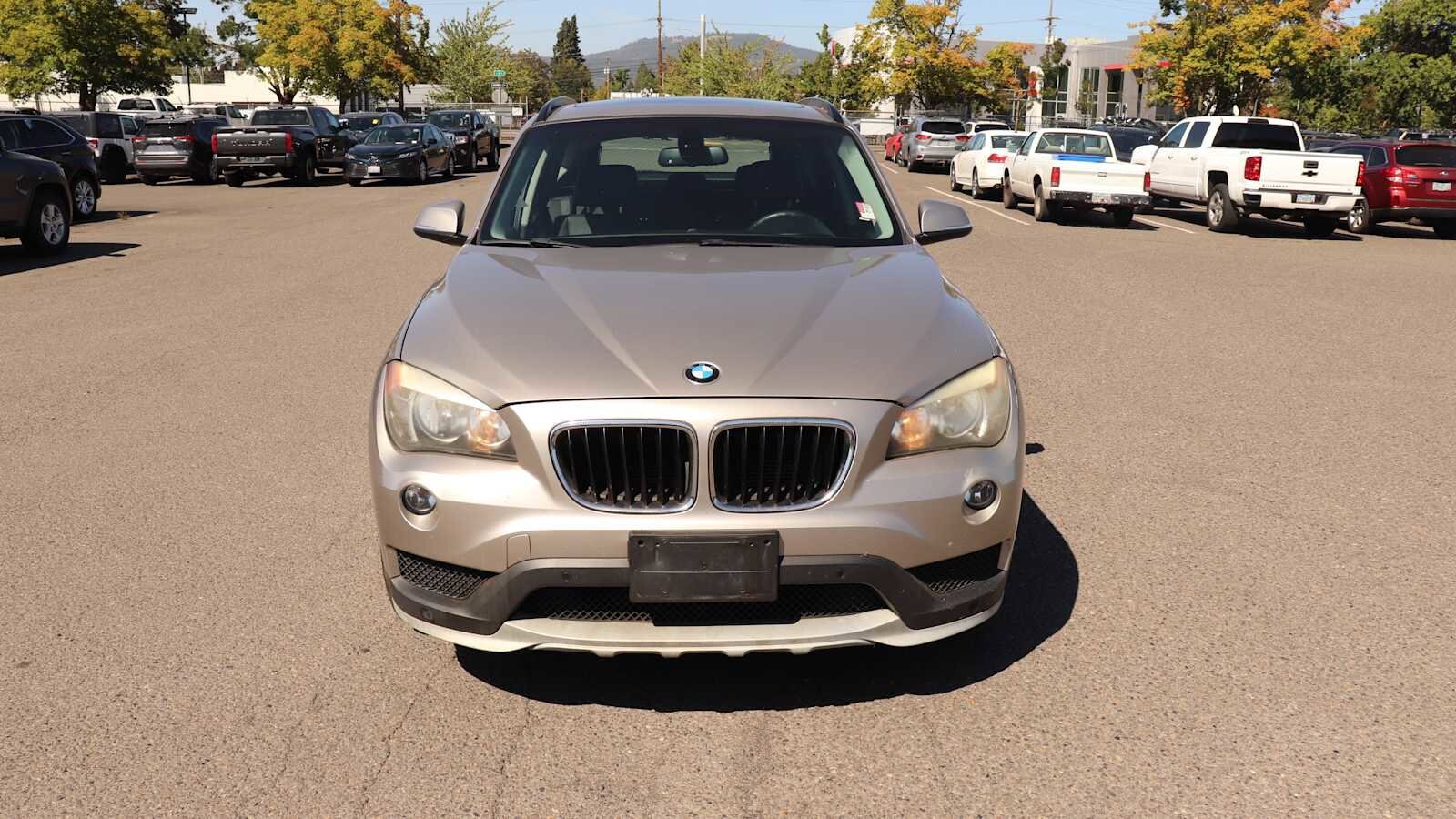 Used 2015 BMW X1 28i with VIN WBAVM1C52FVZ94084 for sale in Springfield, OR