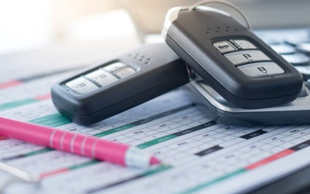 Car Keys on top of Subaru Lease Paperwork