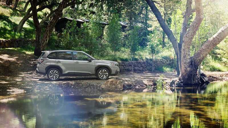 Subaru Forester parked by a lake