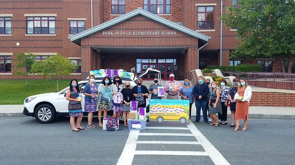 Messages of gratitude and school supply donation table at Long Subaru in support of Park Avenue Elementary School in Webster, MA
