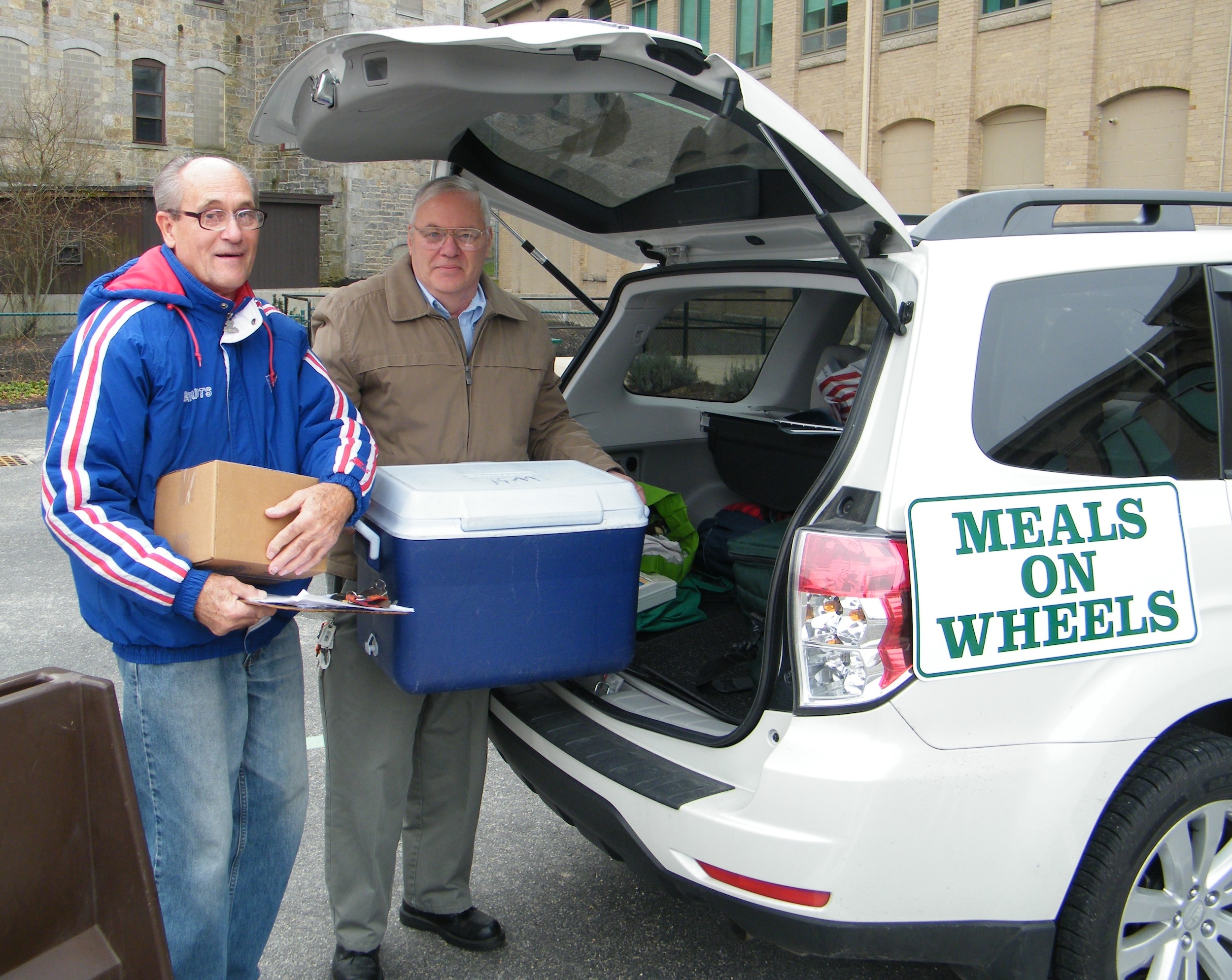 Paul Wrobel Tri-Valley Meals on Wheels Driver with help from Bob Leary, Long Subaru employee and volunteer