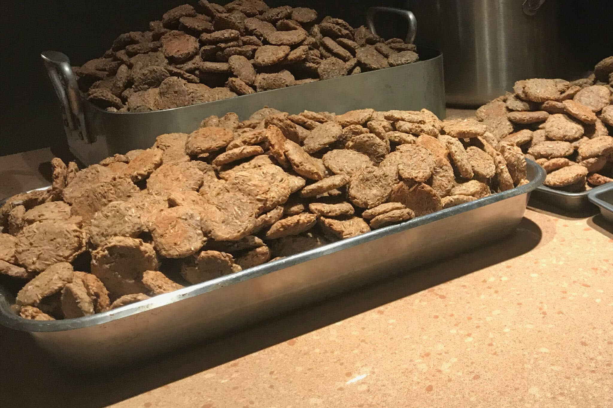 Fresh dog treats in a metal tray
