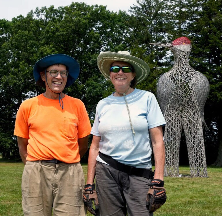 The myth makers posing with their large bamboo bird creation