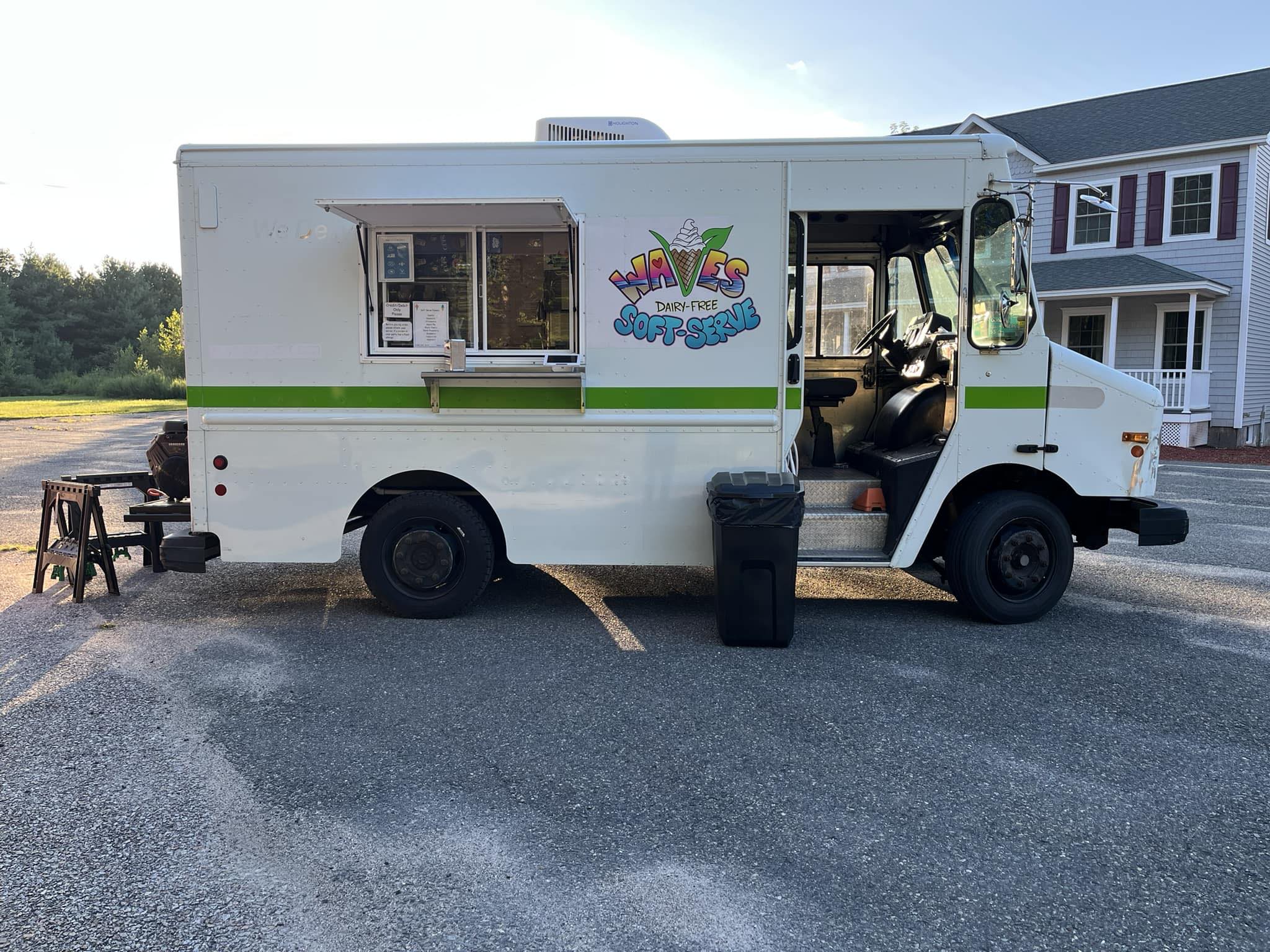 A picture of Waves Dairy Free Soft Serve truck parked outside. ready for customers. 