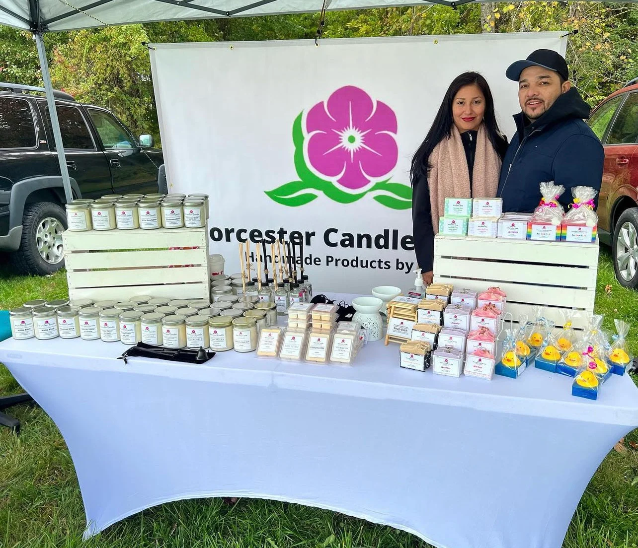 Julia and Edvin set up outside with their products.