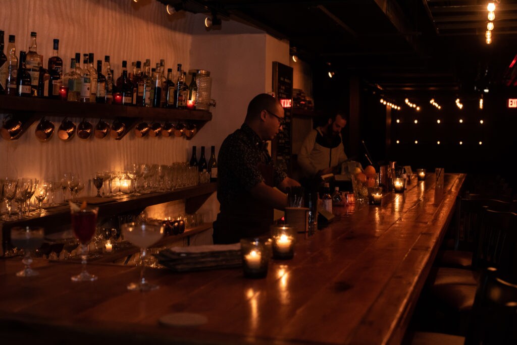The inside of The Mirror. showing a bar in dim lights. 