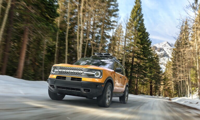 2022 Ford Bronco Exterior Driving Head On In Snowy Mountain Forest