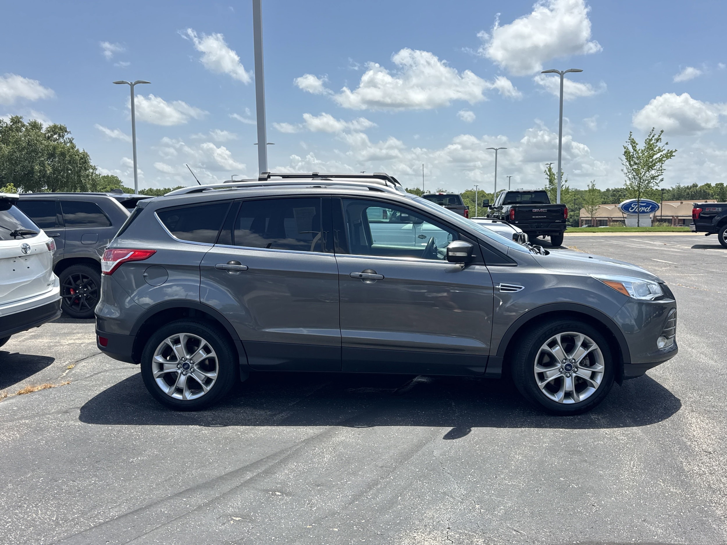 Used 2014 Ford Escape Titanium with VIN 1FMCU0J96EUE12322 for sale in Kansas City