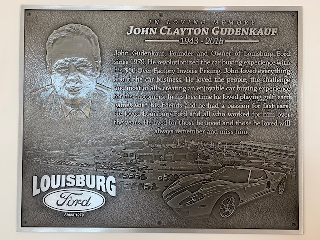 Sign of John Gudenkauf; the original owner of the dealership