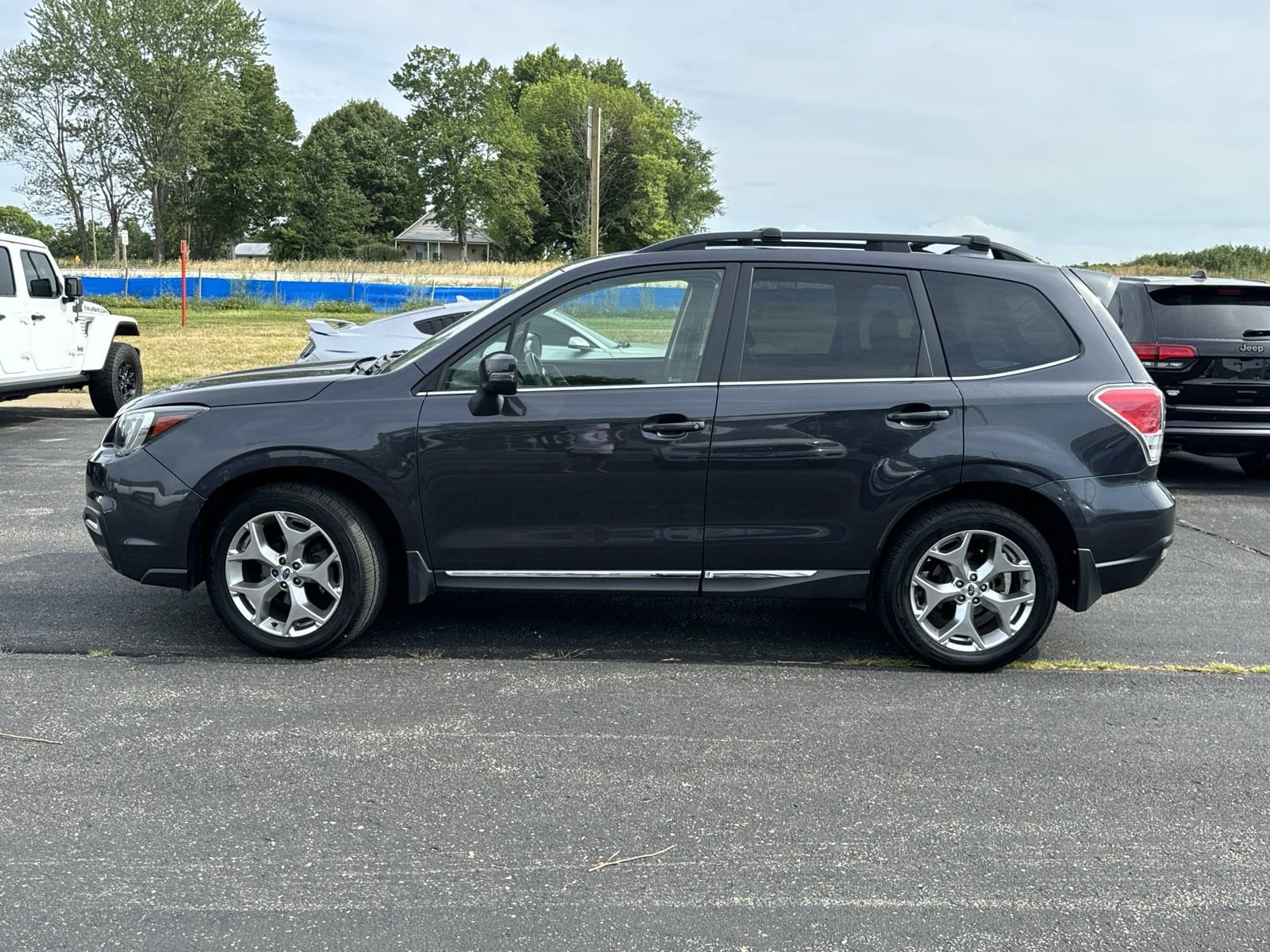 Used 2018 Subaru Forester Touring with VIN JF2SJAWC9JH568801 for sale in Kansas City