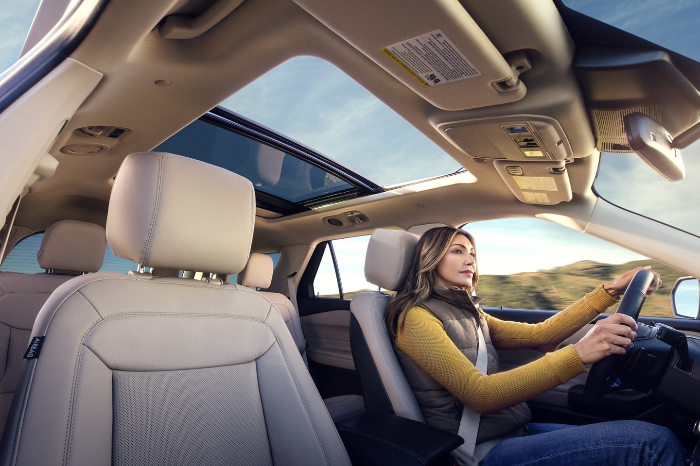 A women driving a Ford vehicle