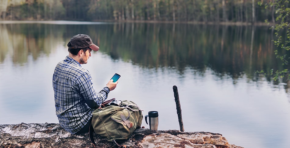A man scrolling through the FordPass app