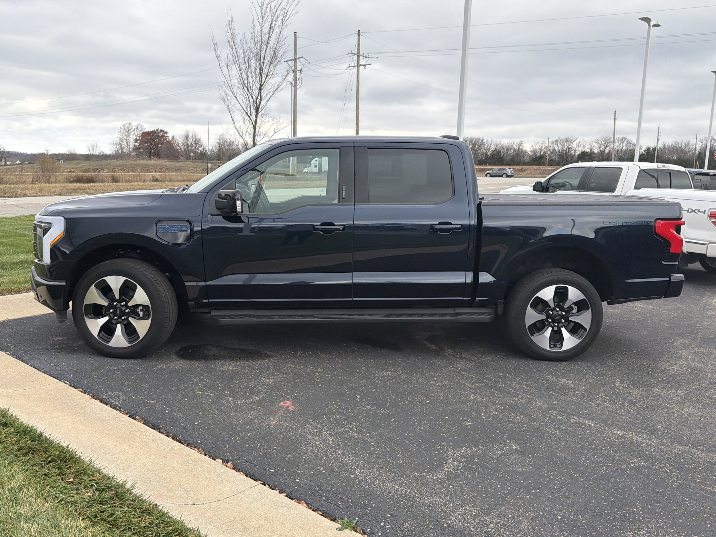 Used 2024 Ford F-150 Lightning Platinum with VIN 1FT6W7L79RWG18776 for sale in Louisburg, KS