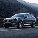 2018 Volvo XC60 driving by mountains