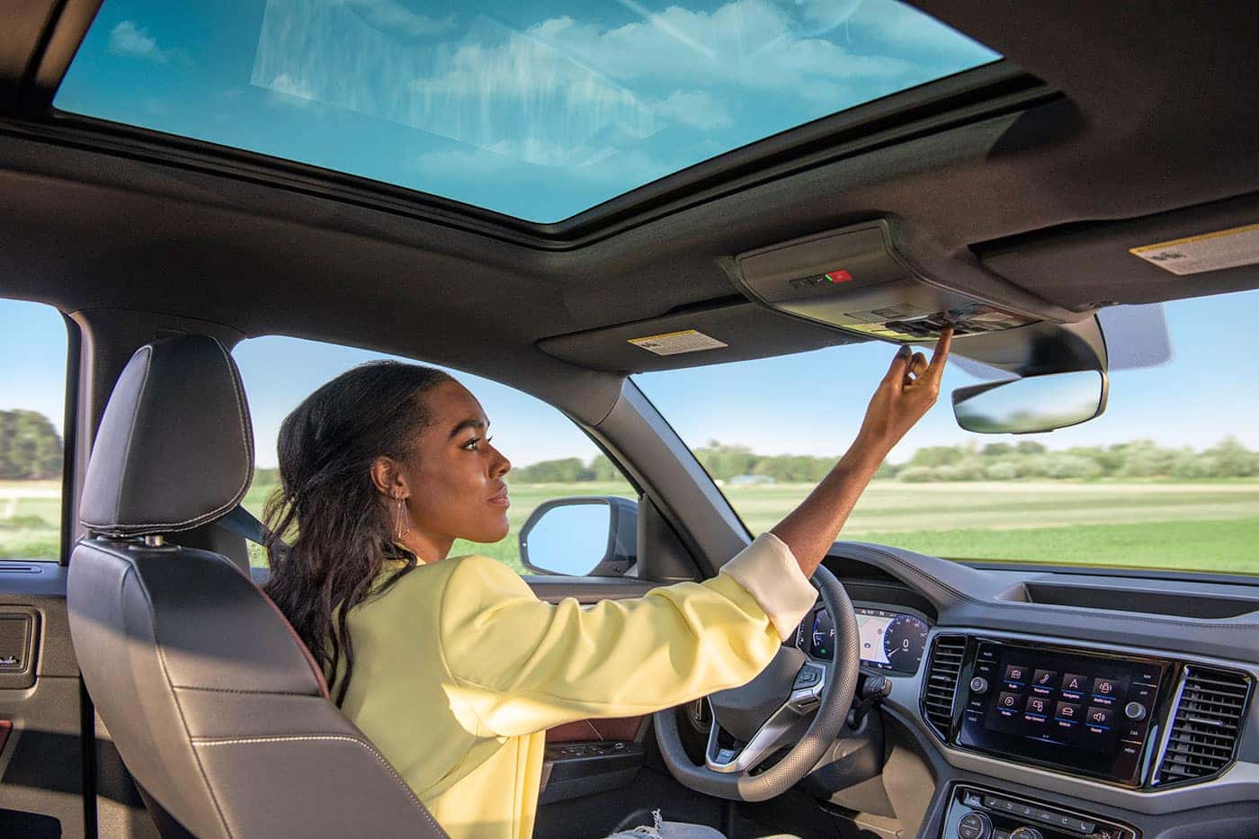 woman driving Volkswagen SUV