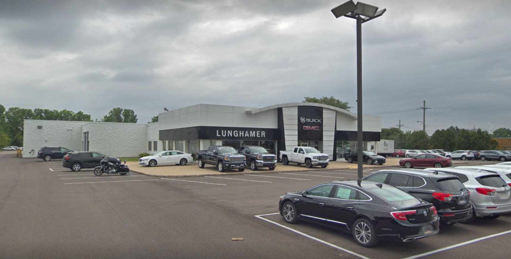 Lunghamer Buick GMC store front view from parking lot.