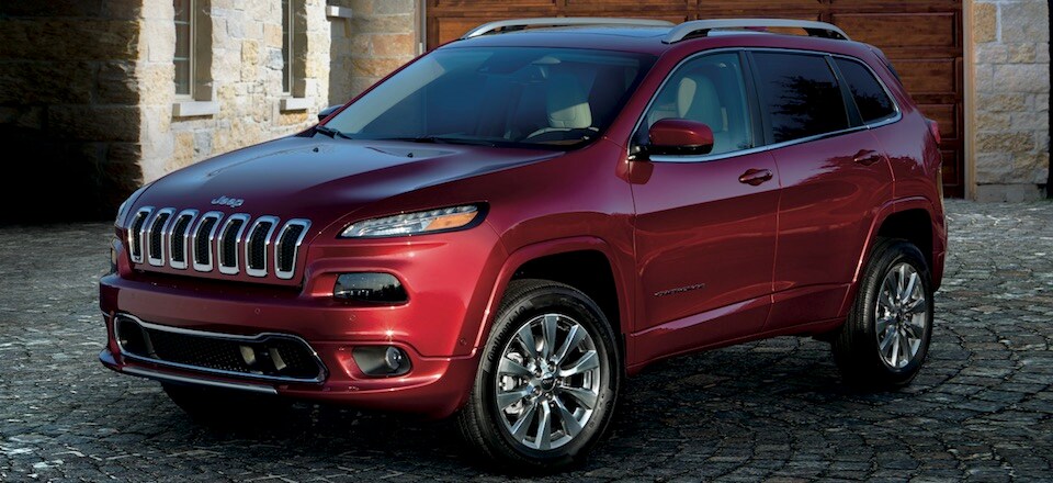 2019 Jeep Cherokee A maroon 2019 Jeep Cherokee parked in a driveway